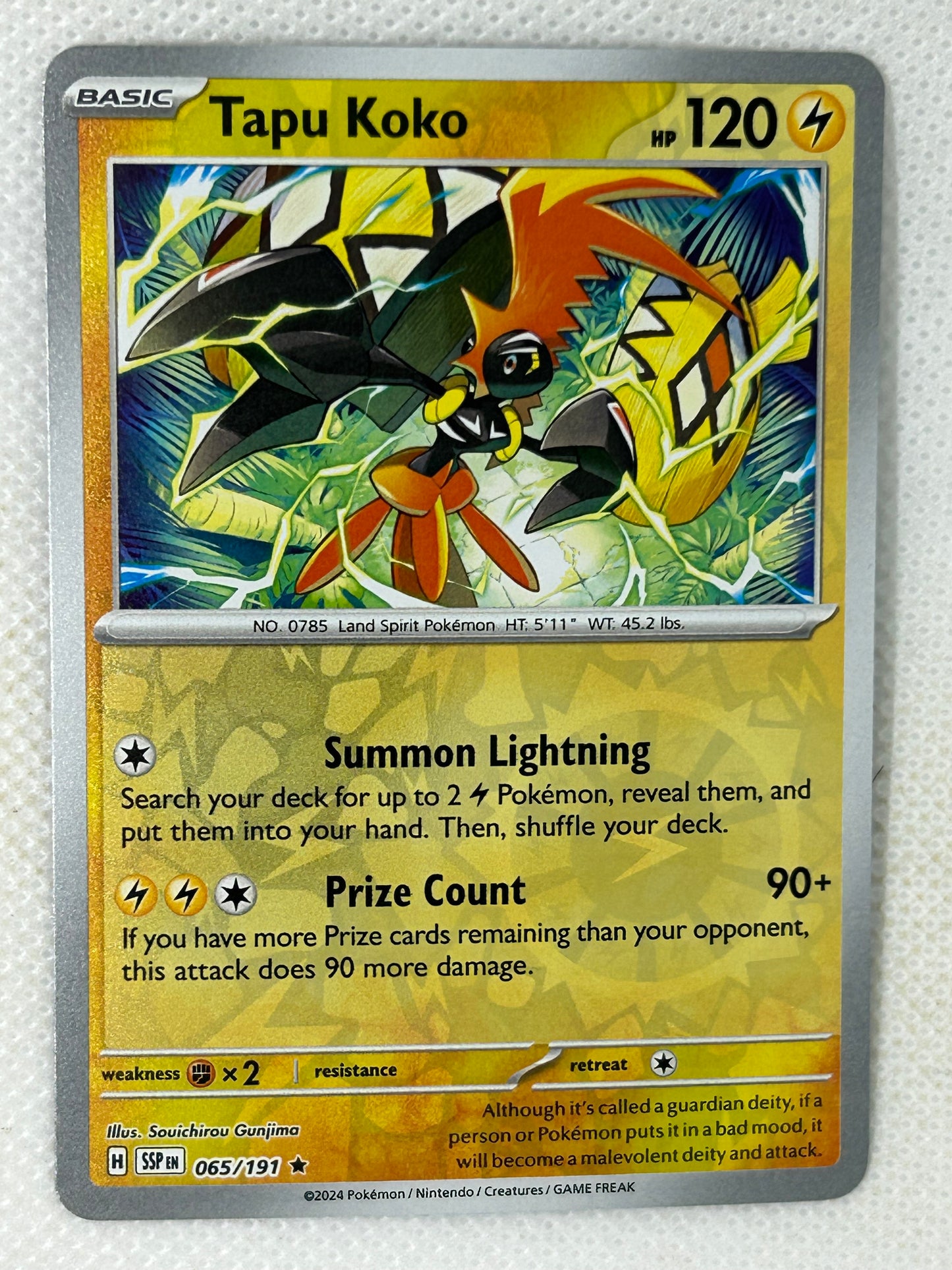 Pokémon Surging Sparks Reverse Holo Tapu Koko 065/191