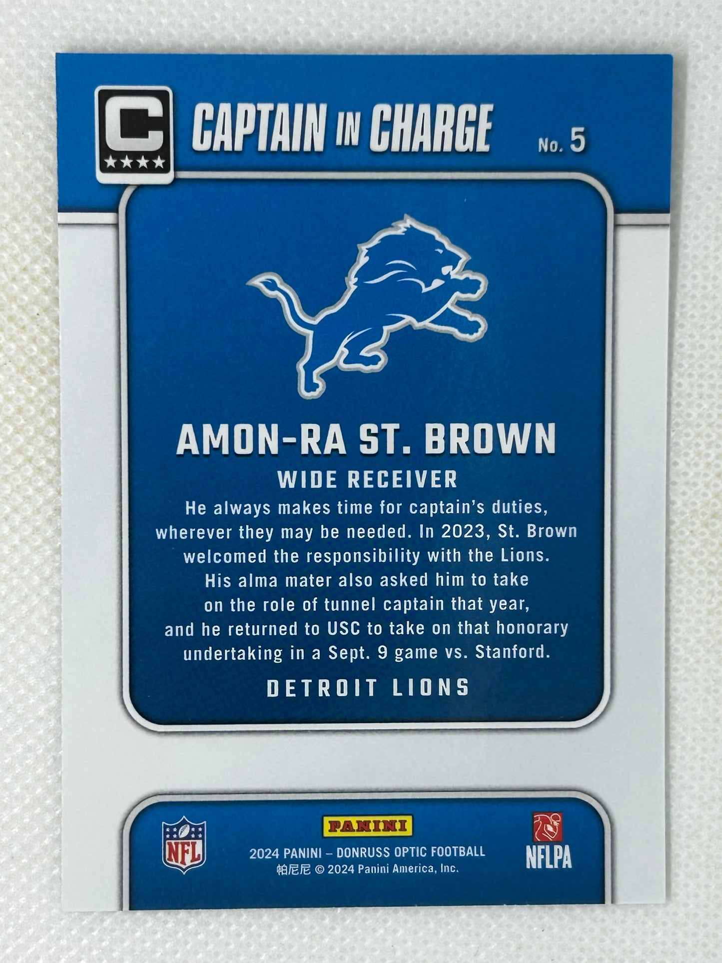 2024 Panini Donruss Optic Amon-Ra St. Brown Captain In Charge #5 Detroit Lions